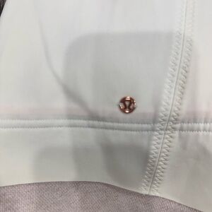 lululemon athletica white jacket with rose gold logo